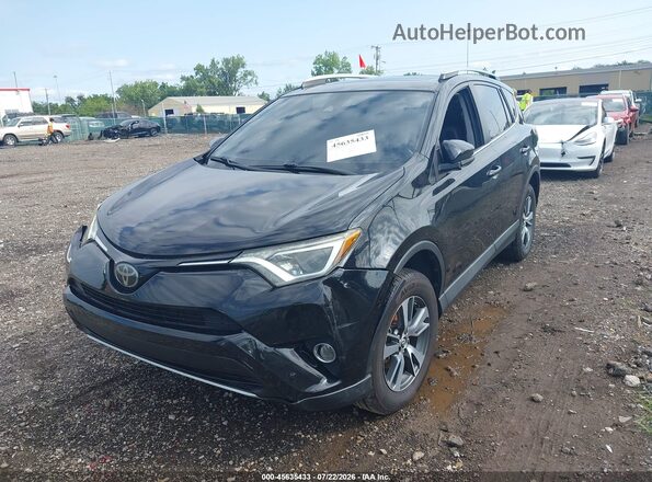 2T3WFREV3JW435268 2018 TOYOTA RAV4 Black უკანა სალონის ხედი