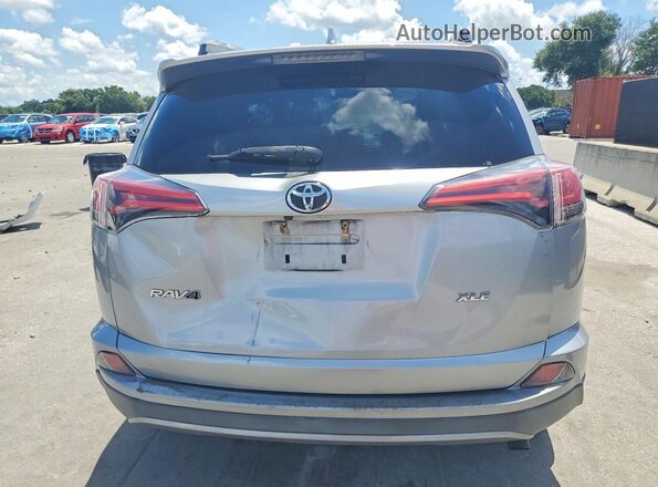 2T3WFREV3JW440552 2018 TOYOTA RAV4 Silver Rear view