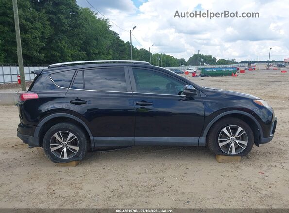 2T3WFREV6GW261415 2016 TOYOTA RAV4 Черный Вид задней части салона