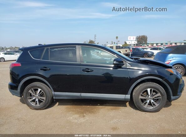 2T3WFREV6JW510853 2018 TOYOTA RAV4 Black Rear interior view