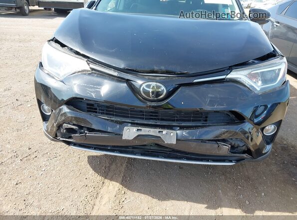 2T3WFREV6JW510853 2018 TOYOTA RAV4 Black Front view
