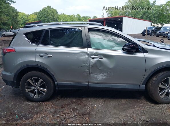 2T3WFREV7JW496123 2018 TOYOTA RAV4 Silver Вид задньої частини салону