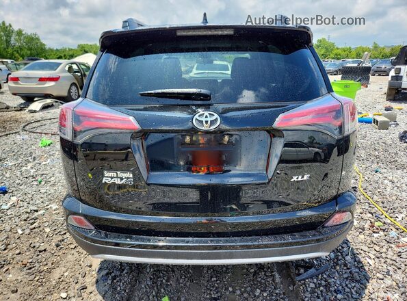2T3WFREV8JW434312 2018 TOYOTA RAV4 Black Rear view
