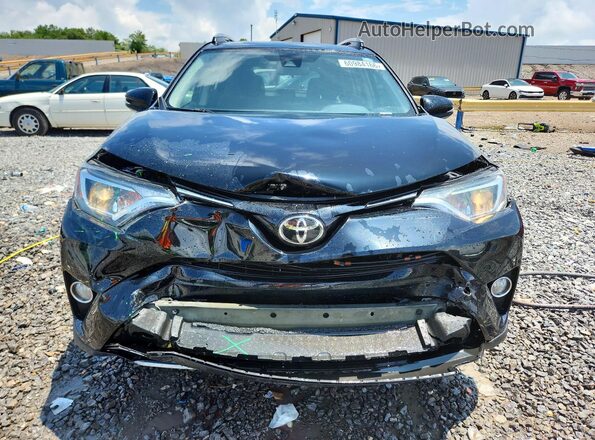 2T3WFREV8JW434312 2018 TOYOTA RAV4 Black Front view