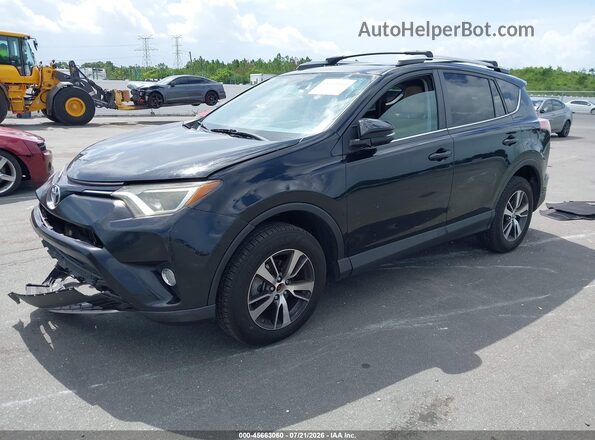 2T3WFREVXGW306629 2016 TOYOTA RAV4 Black წინა მარცხენა ხედი სამი მეოთხედიდან