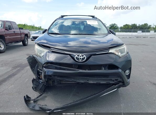 2T3WFREVXGW306629 2016 TOYOTA RAV4 Black ხელსაწყოთა პანელის ხედი