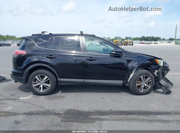 2T3WFREVXGW306629 2016 TOYOTA RAV4 Black უკანა სალონის ხედი