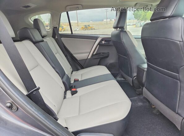 2T3YFREV4JW490711 2018 TOYOTA RAV4 Gray Vista interior trasera