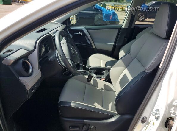 2T3YFREVXGW264102 2016 TOYOTA RAV4 White Widok wnętrza z przodu