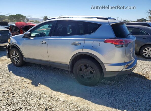 2T3ZFREV1GW261867 2016 TOYOTA RAV4 Silver Trasero izquierdo