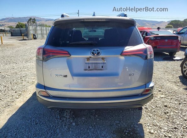 2T3ZFREV1GW261867 2016 TOYOTA RAV4 Silver Vista trasera