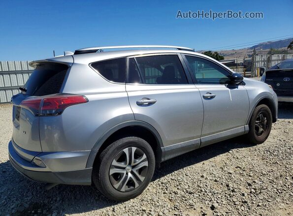 2T3ZFREV1GW261867 2016 TOYOTA RAV4 Silver Trasero derecho