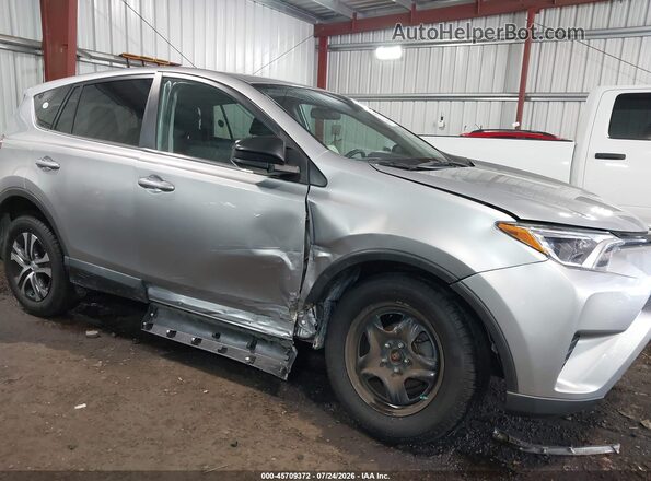 2T3ZFREV1JW471926 2018 TOYOTA RAV4 Серый Вид спереди