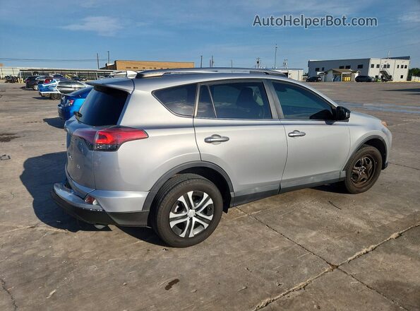 2T3ZFREV2HW332124 2017 TOYOTA RAV4 Silver Հետևի աջ