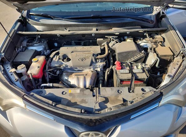2T3ZFREV2HW332124 2017 TOYOTA RAV4 Silver Սալոնի հետևի տեսք