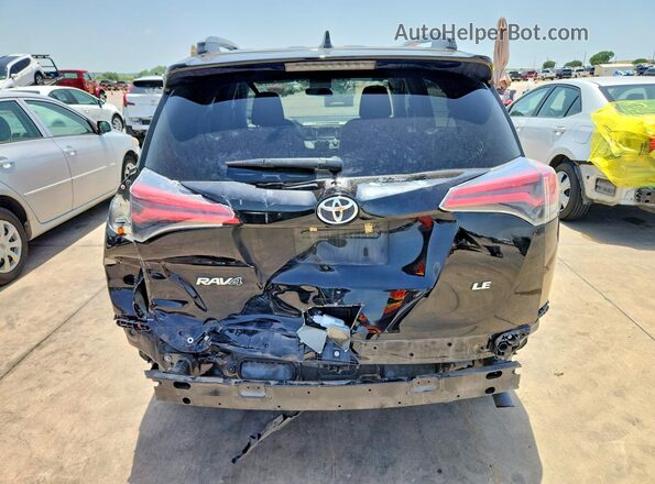 2T3ZFREV2JW433234 2018 TOYOTA RAV4 Black Rear view