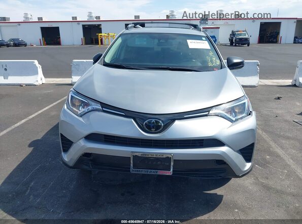 2T3ZFREV2JW455363 2018 TOYOTA RAV4 Silver Вид задньої частини салону
