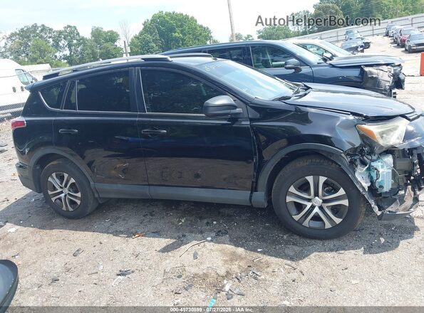 2T3ZFREV3JW512850 2018 TOYOTA RAV4 Black Vista interior trasera