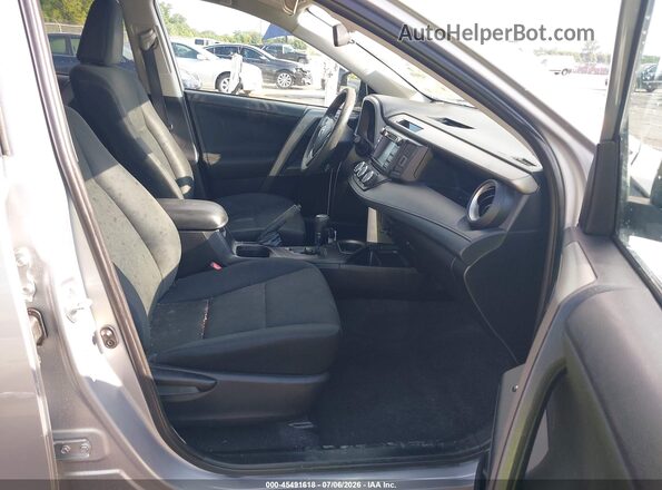 2T3ZFREV4GW304114 2016 TOYOTA RAV4 Серебряный Вид салона спереди