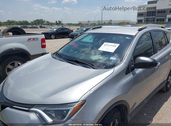 2T3ZFREV4JW456434 2018 TOYOTA RAV4 Gray Вид спереду