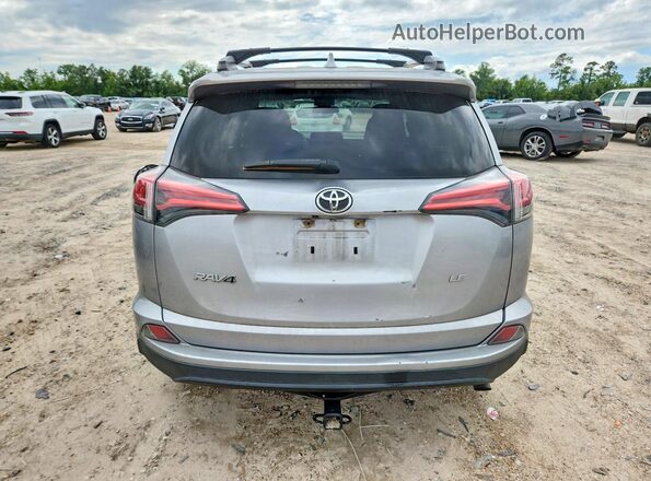 2T3ZFREV5HW326768 2017 TOYOTA RAV4 Silver Vista trasera