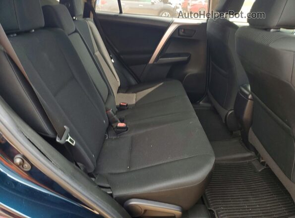 2T3ZFREV6JW463031 2018 TOYOTA RAV4 Blue Rear interior view