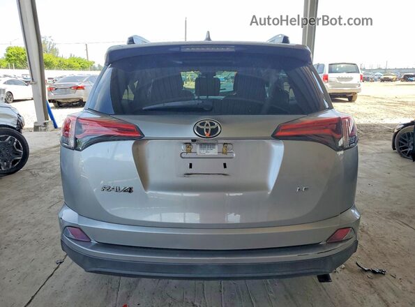2T3ZFREV7JW452989 2018 TOYOTA RAV4 Silver Вид ззаду