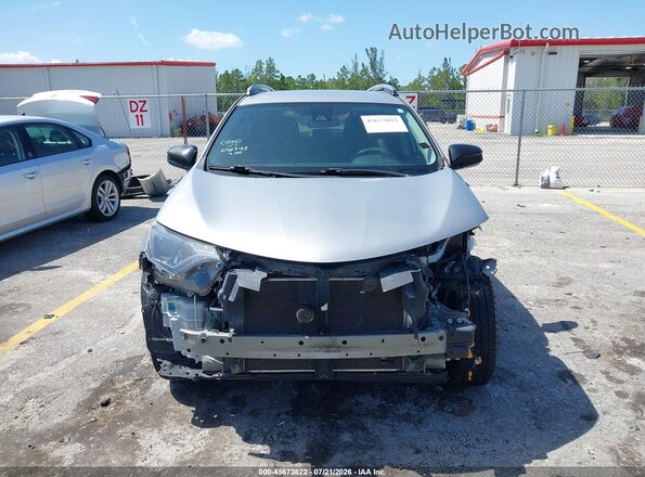 2T3ZFREV8JW418365 2018 TOYOTA RAV4 Silver Vista interior trasera