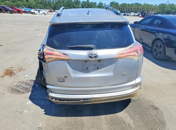 2T3ZFREV9GW272633 2016 TOYOTA RAV4 Серебряный Вид сзади