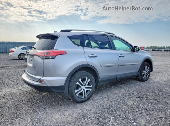 2T3ZFREV9HW393194 2017 TOYOTA RAV4 Silver Trasero derecho