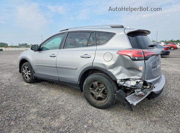 2T3ZFREV9HW393194 2017 TOYOTA RAV4 Silver Trasero izquierdo