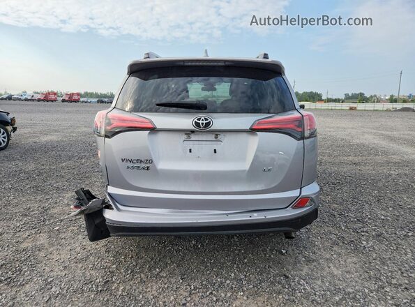 2T3ZFREV9HW393194 2017 TOYOTA RAV4 Silver Vista trasera