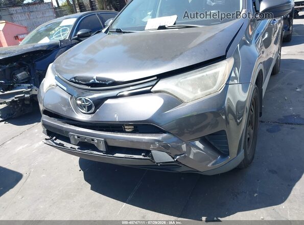 2T3ZFREVXGW306871 2016 TOYOTA RAV4 Gray Вид задньої частини салону