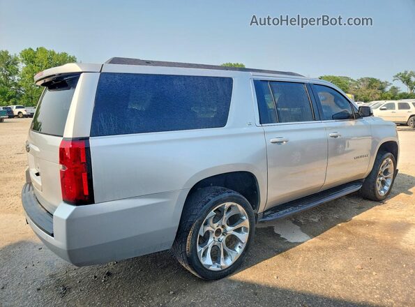 1GNSKHKC7KR395180 2019 CHEVROLET SUBURBAN Серебряный Передняя правая четверть