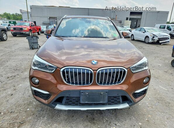 WBXHU7C3XH5H32940 2017 BMW X1 Brown Вид ззаду