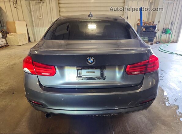 WBA8E5G56HNU22613 2017 BMW 3 SERIES Gray Front interior view