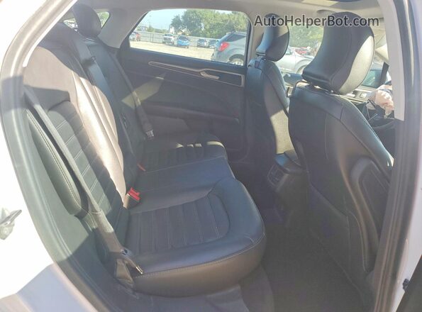 3FA6P0H95GR328975 2016 FORD FUSION White Vista de los asientos traseros