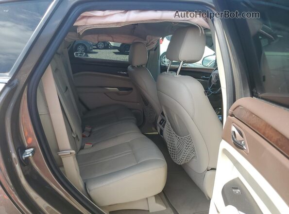 3GYFNBE36GS555512 2016 CADILLAC SRX Gold Widok wnętrza z tyłu