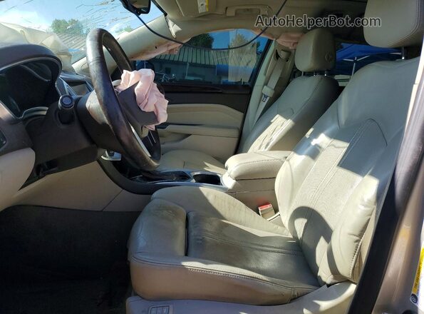 3GYFNBE39GS547386 2016 CADILLAC SRX Gold Widok wnętrza z przodu