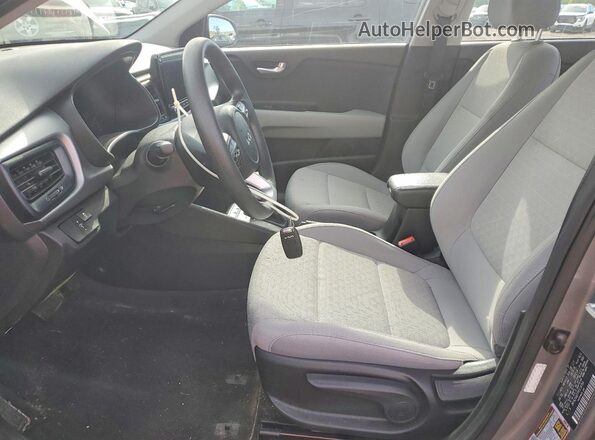 3KPA24AD7PE618764 2023 KIA RIO Silver Front interior view