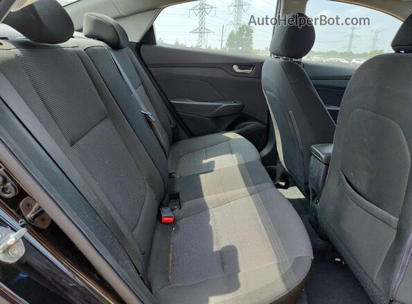 3KPC24A38JE016933 2018 HYUNDAI ACCENT Black Rear seats view