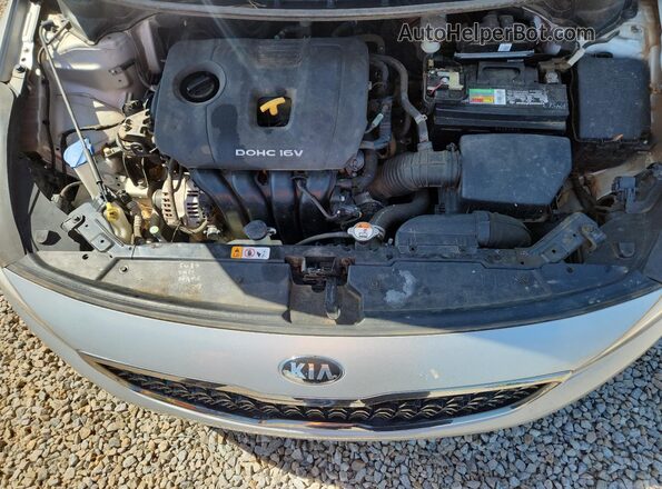 3KPFL4A79HE134884 2017 KIA FORTE Серебряный Вид задней части салона