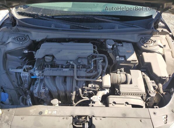 3KPFT4DE9SE102857 2025 KIA K4 Gray Vista interior trasera