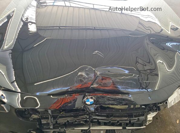 3MW33CM0XT8G27893 2026 BMW 2 SERIES Black Vista interior trasera