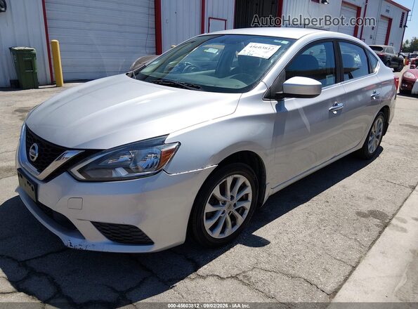 3N1AB7AP1KY394526 2019 NISSAN SENTRA Silver წინა მარცხენა ხედი სამი მეოთხედიდან