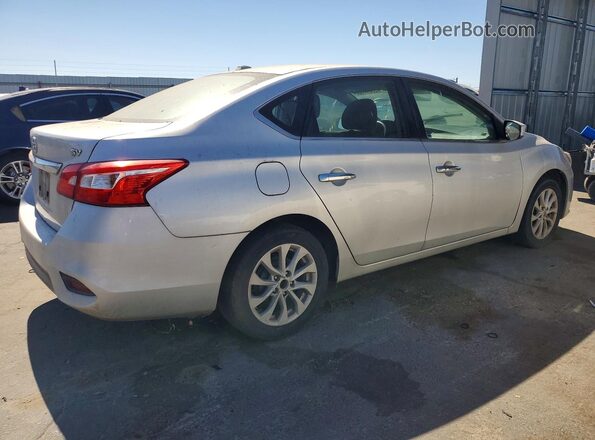 3N1AB7AP5JY245681 2018 NISSAN SENTRA Серебряный Задняя правая четверть