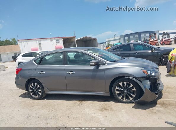 3N1AB7AP5KY365658 2019 NISSAN SENTRA Gray Вид задньої частини салону