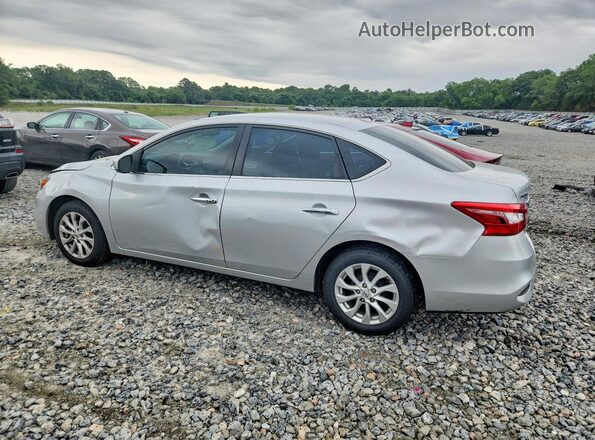 3N1AB7AP9KY453564 2019 NISSAN SENTRA Silver Trasero izquierdo