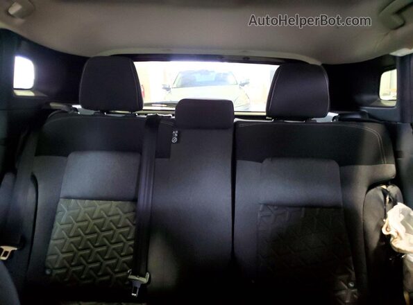3N8AP6CB6SL390323 2025 NISSAN KICKS Red Vista de los asientos traseros