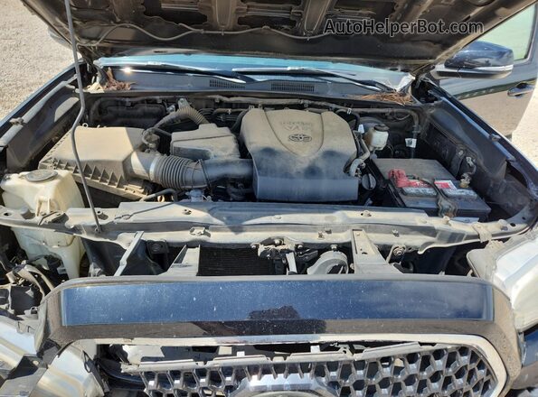3TMAZ5CN2JM067678 2018 TOYOTA TACOMA Black Widok wnętrza z tyłu